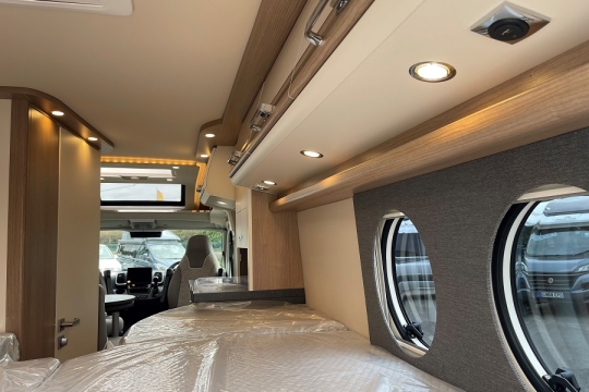 malibu-van-640-le-rb-two-room-interior-bed-to-front.jpg